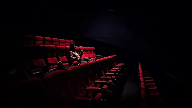 Film crew on set with professional cinema camera and lighting